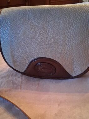 Vintage Dooney & Bourke Cream Pebbled Leather Crossbody with Brown Trim.